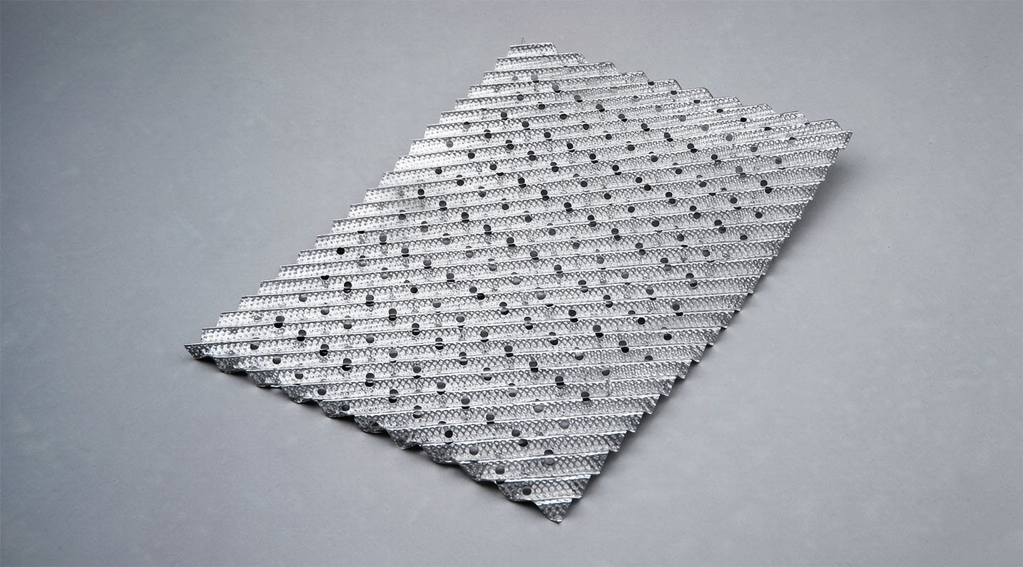 Metal perforated plate structured packing with visible corrugation and precision perforations