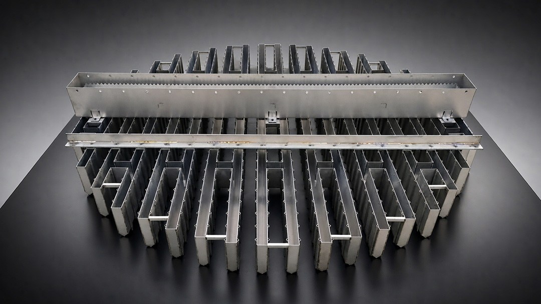 Top view of orifice pan showing uniform drip point pattern and vapor risers